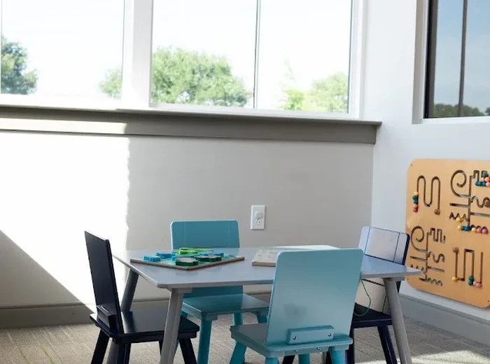 A therapy table set up with child sized chairs at Hope Therapy Lafayette