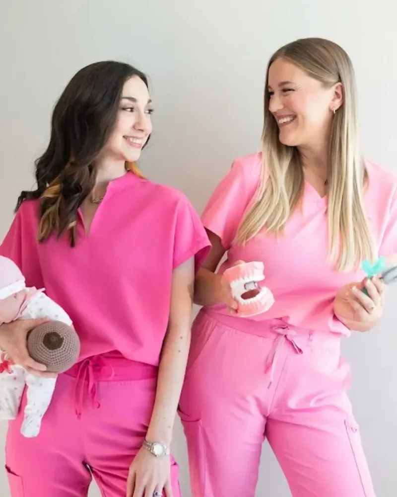 Therapists preparing oral motor tools and a feeding doll before a session