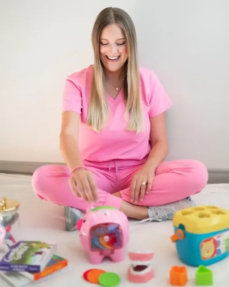 Speech therapist setting up toys before a first session