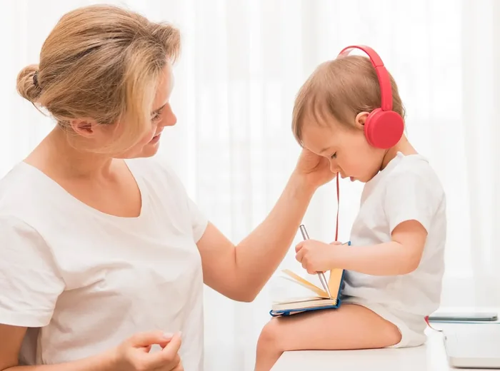 Child wearing headphones during a listening activity