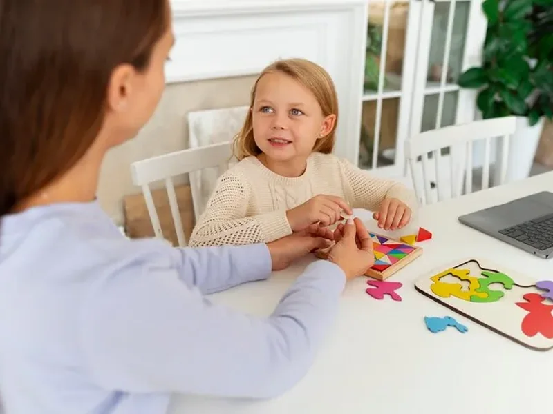 A child working on letters and reading during a literacy session