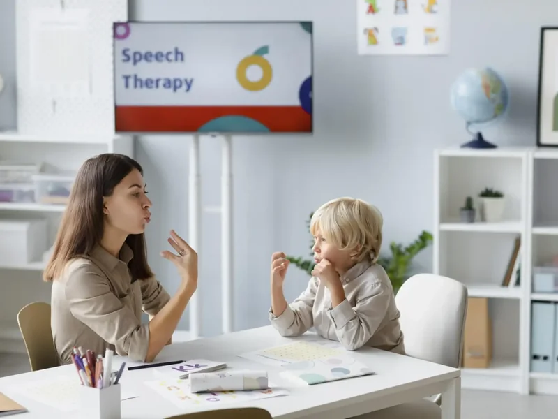 Speech therapist working on early sounds with a toddler