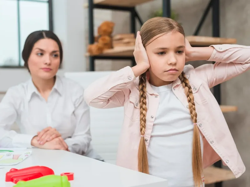 A child working on speech sounds during a therapy session
