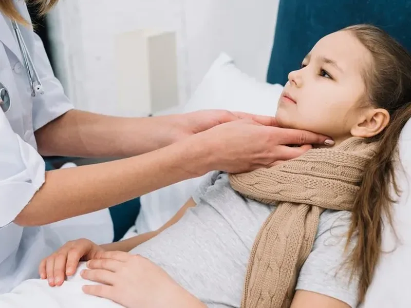 A child in a dental chair during a jaw and mouth check